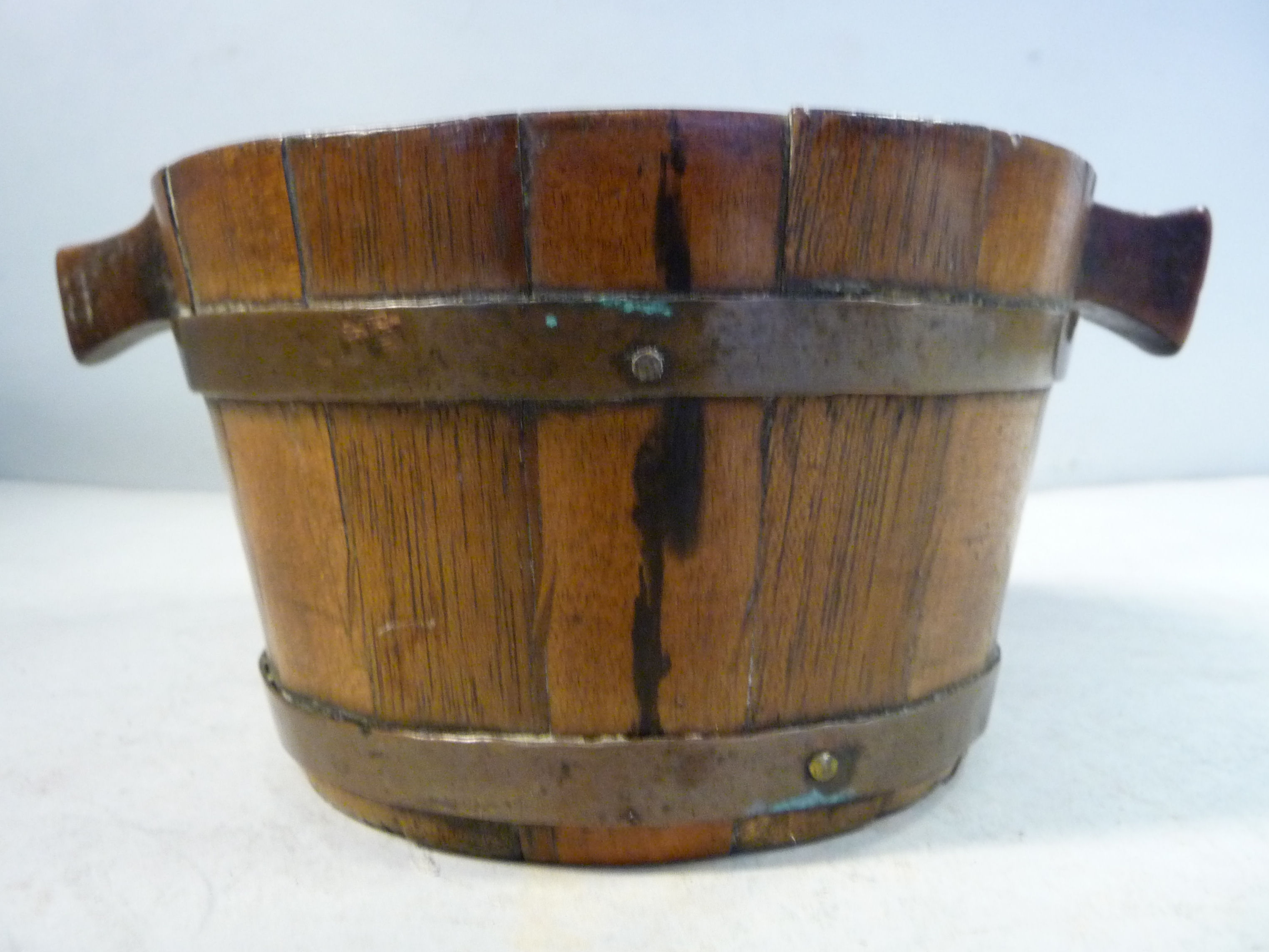 A mid/late 18thC coopered walnut quaiche with nailed,