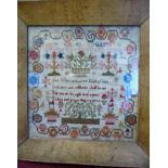 An early 19thC sampler, featuring four lines of text, the alphabet and extensive border ornament,
