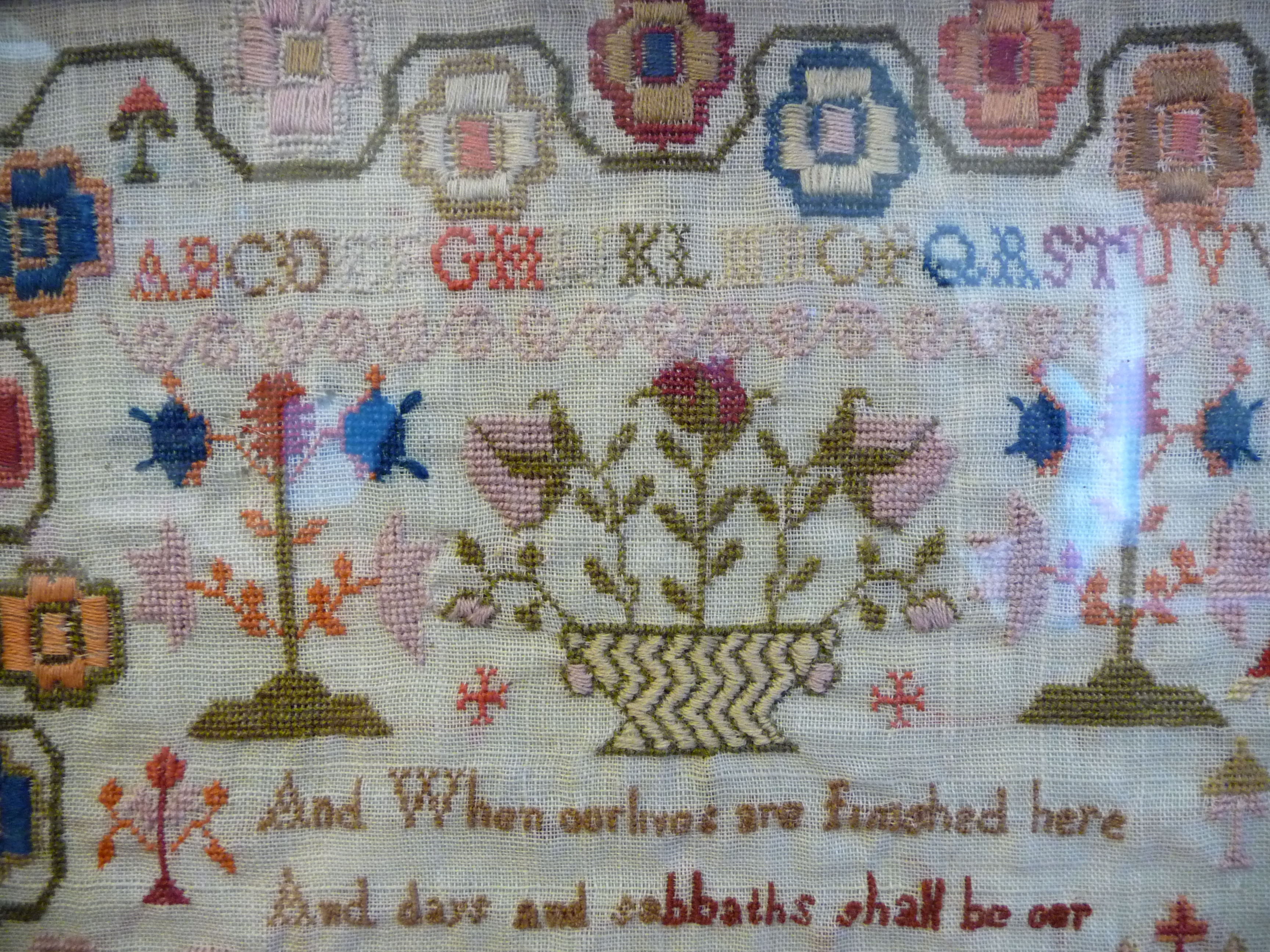 An early 19thC sampler, featuring four lines of text, the alphabet and extensive border ornament, - Image 5 of 10