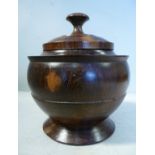 An early 19thC turned, one-piece lignum vitae spice storage jar,