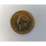 A United States of America One Dollar gold coin 1853