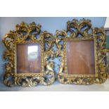 A matched pair of late 19thC Continental foliate scroll carved giltwood picture frames with glazed