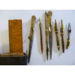 A pocket size set of late 19thC engineer's steel and lacquered brass drawing instruments with an