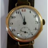 A 9ct gold round cased wristwatch, faced by a white enamel Arabic dial with subsidiary seconds,