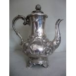 An early Victorian silver coffee pot of bulbous form with a long, wide neck, an S-shaped spout,