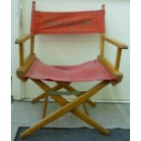 A beech framed folding director's chair, the pink fabric back inscribed Andre De Toth,