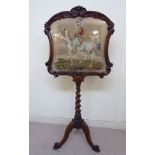 A 19thC carved rosewood framed polescreen, the tapestry panel depicting an Arab on horseback,