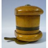 An early 20thC turned and brass mounted string dispenser with a rotating shutter on the base