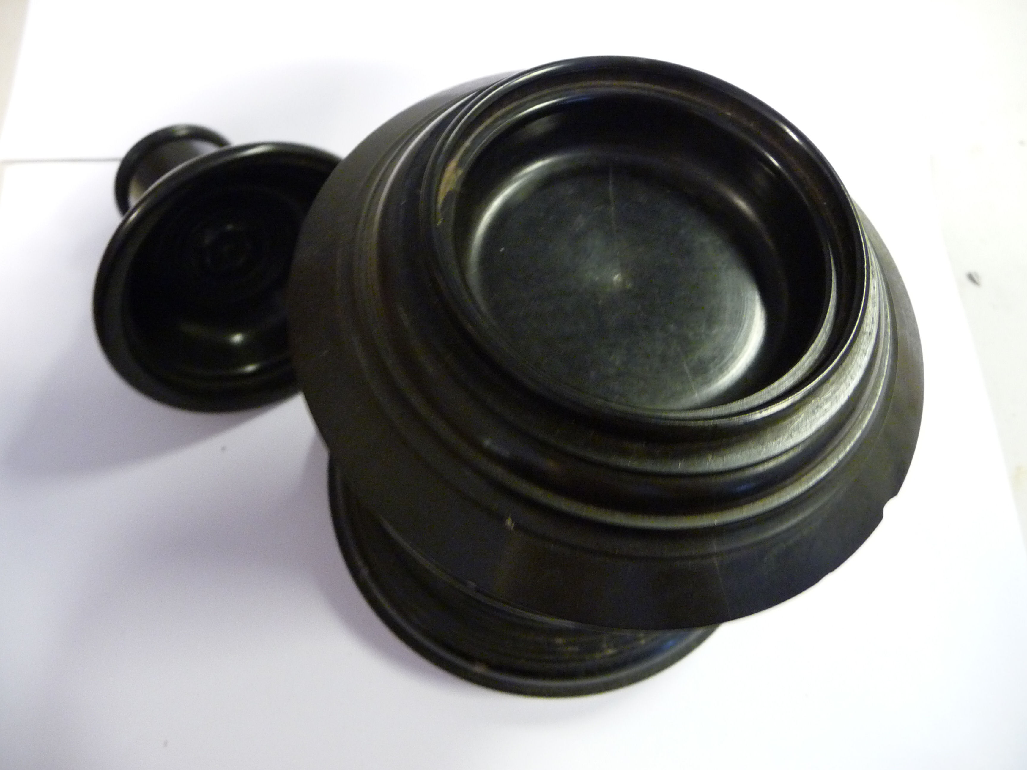 A late 19th/early 20thC black composition three part smoker's companion, comprising a drum base, - Image 2 of 5