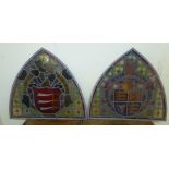 A 19thC shield shaped stained and painted leaded glass panel,