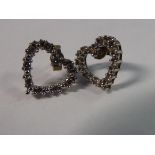 A pair of 9ct gold heart shaped stud earrings,