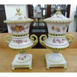 A pair of House of Heritage china campana design urns and covers,
