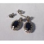A pair of 18ct white gold diamond and sapphire cluster pendant earrings 11