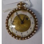 A late 19thC lady's engine turned and seed pearl mounted yellow metal cased pocket watch,