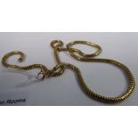 A yellow metal snake-link necklace,