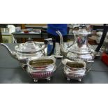 An Edwardian silver four piece tea set of oval, ogee,