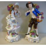 A pair of 20thC German porcelain figures, a standing young man and woman,