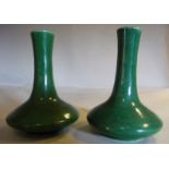 A pair of late 19thC Chinese apple green glazed porcelain bottle vases of squat,