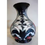 A modern Moorcroft pottery vase of squat, bulbous form,