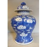 An early 20thC Chinese porcelain baluster shaped jar and domed cover,