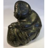 An Inuit carved black stone sculpture,