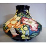 A modern Moorcroft pottery vase of squat bulbous form,