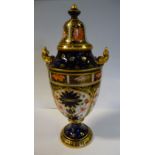 A Royal Crown Derby china pedestal vase of shouldered ovoid form with a domed cover,