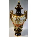 A Royal Crown Derby china pear shaped pedestal vase with a narrow neck and a flared,