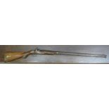 A mid 19thC percussion action rifle with a flush fitting hinged brass capped compartment in the