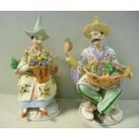 A pair of 20thC German porcelain figures,