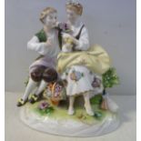 A 20thC German porcelain group, a seated youth with a dove and a maiden holding a rose,