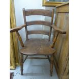 A late 19thC beech and elm framed ladder back elbow chair, the solid,
