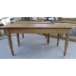 A late Victorian rustically constructed pine farmhouse style kitchen table,