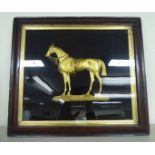 An early 19thC gilt metal plaque, an equestrian study, cast as a standing,