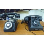 A mid 20thC Danish black moulded resin cased telephone with a rotating dial and a cradle;