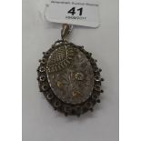 A Victorian silver pendant locket with engraved floral ornament Birmingham 1889 11