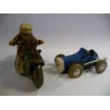 A Schuco Sport friction powered painted tinplate model racing motorcyclist wearing no.