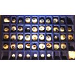 A collection of thirty-six glass eyes with differing handpainted irises and sizes for both left and