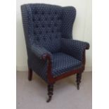 A William IV mahogany showwood framed, lyre front, wingback armchair, upholstered in blue fabric,