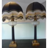 A pair of modern lacquered and black painted brass table lamps,