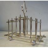 A Walker & Hall Christopher Dresser inspired silver plated six division,