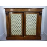 A William IV rosewood side cabinet, the top with a straight frieze and a bead reel carved border,