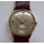An Omega 9ct gold cased wristwatch, faced by a baton and Arabic dial with subsidiary seconds,