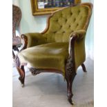 A late Victorian fruiting vine carved walnut framed salon chair with a green dralon upholstery back,