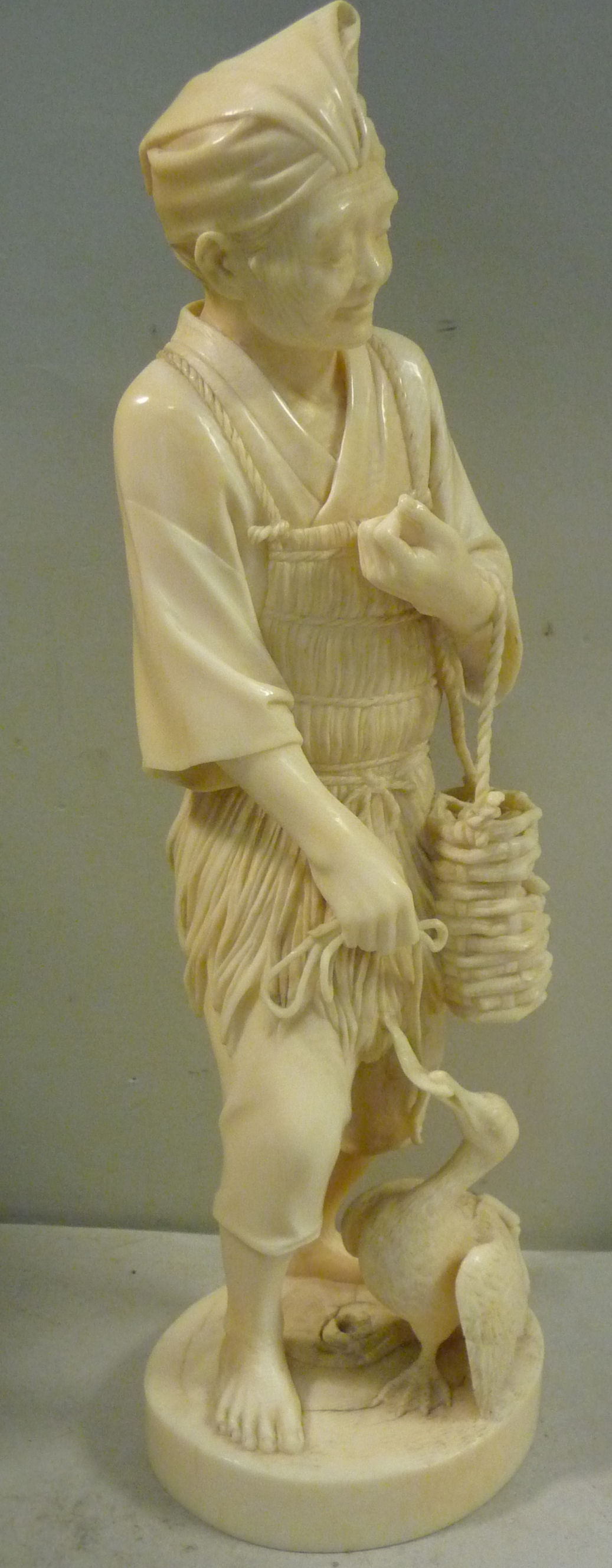 A 19thC Japanese carved ivory standing figure, - Image 4 of 8