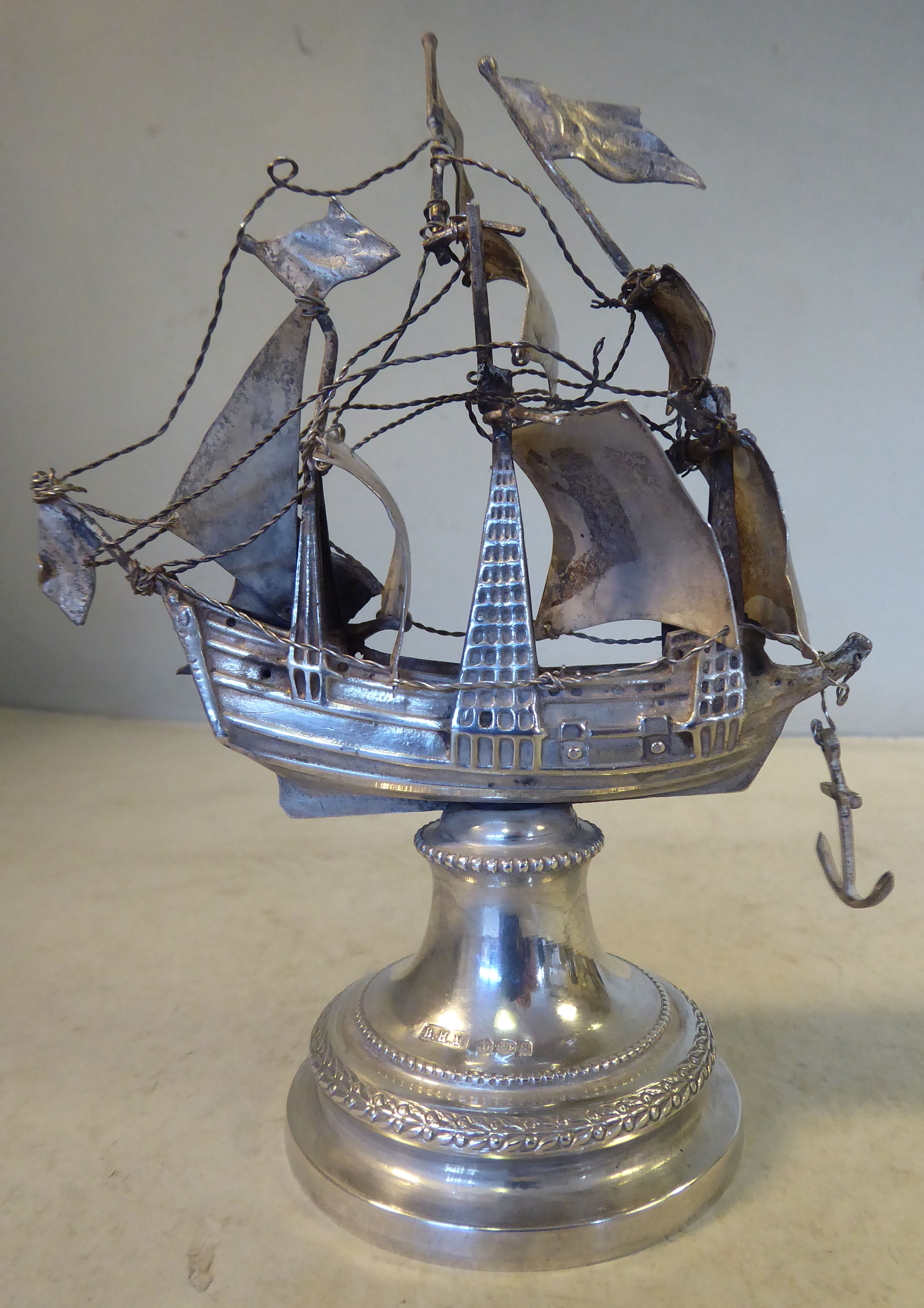 An early 20thC silver coloured metal model, a triple masted galleon with sails and rigging, - Image 2 of 4