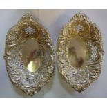 A pair of Edwardian oval sweet baskets with pressed and pierced floral,