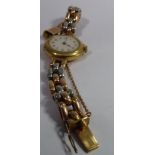 A lady's gold coloured metal cased wristwatch, on a bi-coloured oval link bracelet,