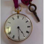 An 18ct gold cased fob watch with engraved ornament,
