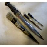 A late 19thC Scottish dirk dagger Trousse short sword with a carved,
